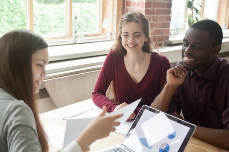 young couple meeting with insurance agent