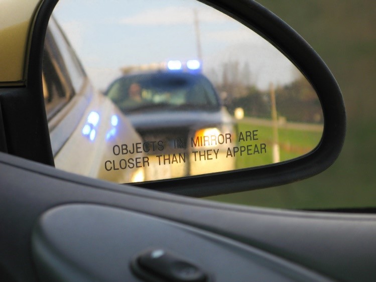cop car in side mirror