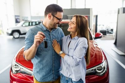 couple buying a new car 